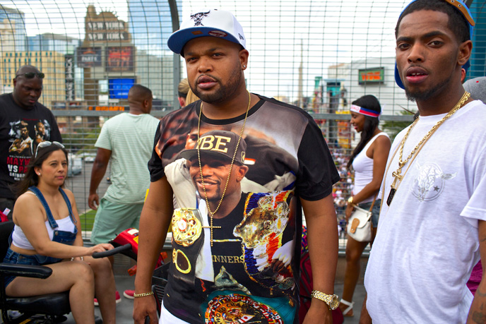 Jay Beets, center, of Chicago, Ilinois, isn't sure where he's watching the fight yet, seen outside the MGM Grand on the Las Vegas Strip on Saturday, May 2, 2015.